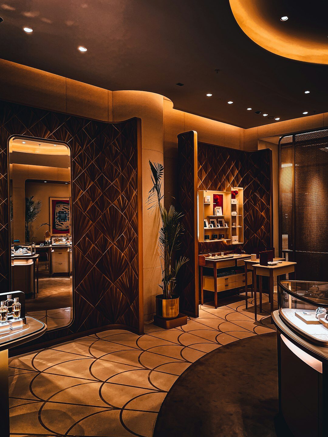 Elegant boutique interior with glass display cases and warm lighting