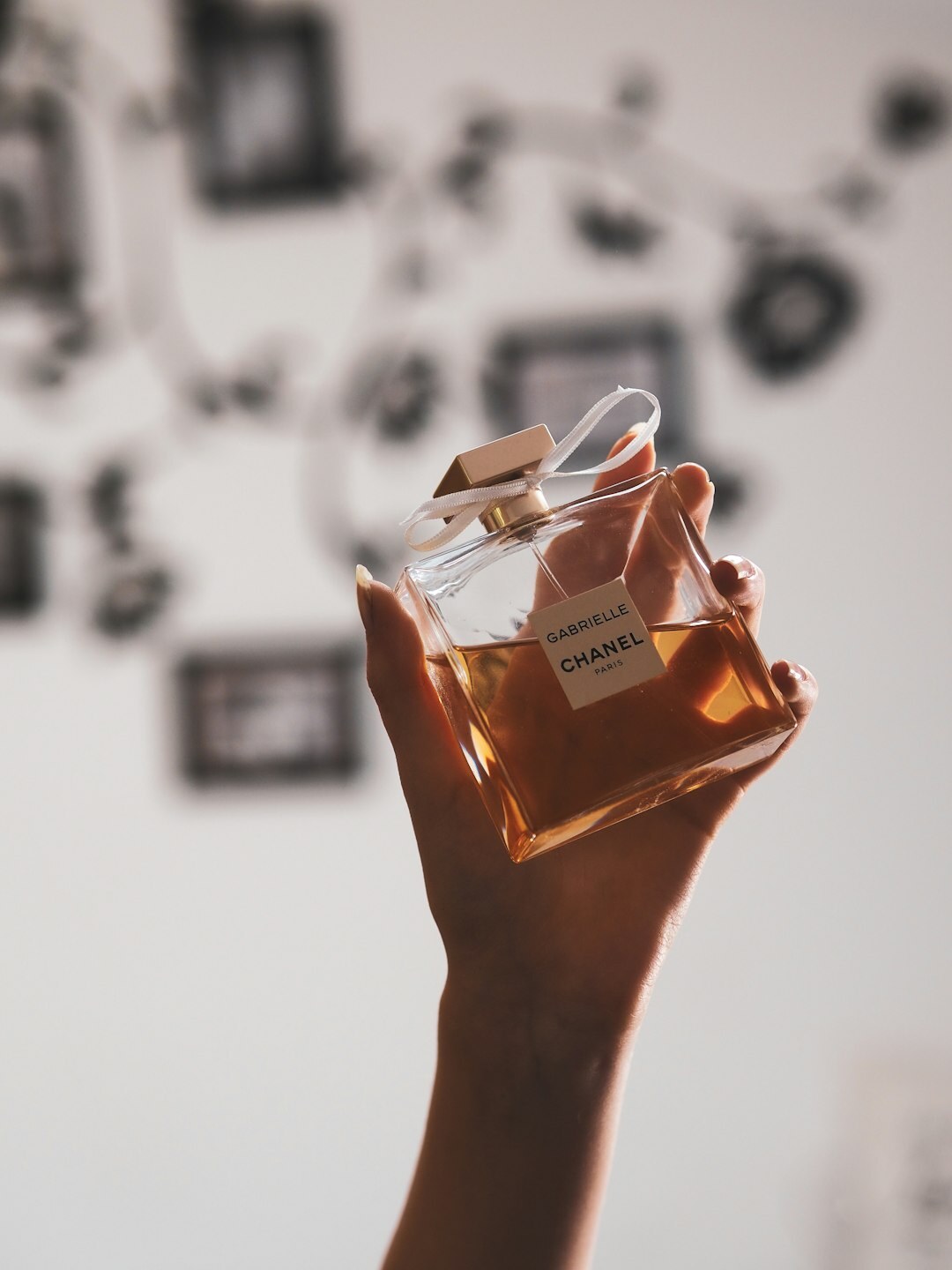 woman spraying perfume