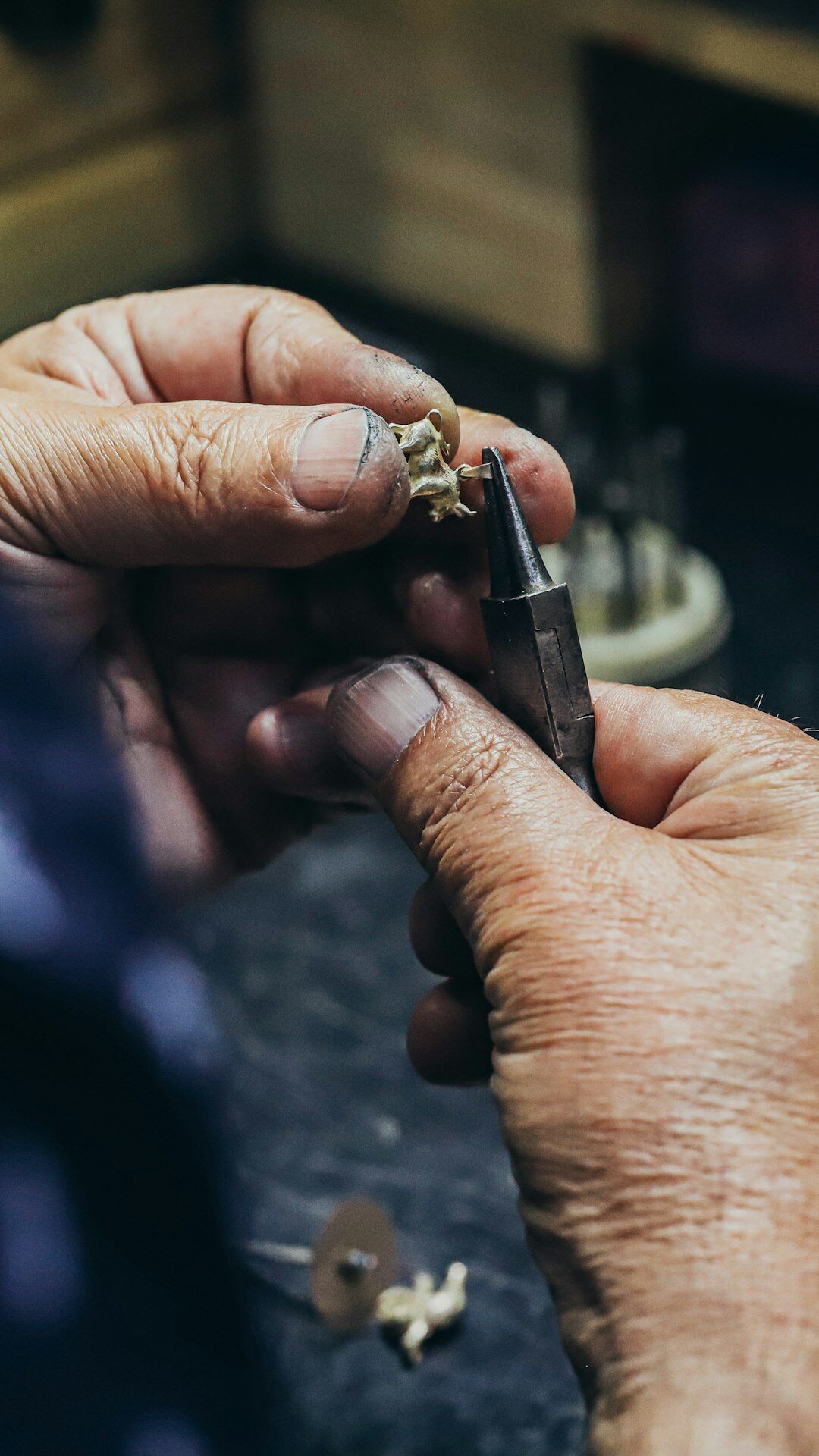 artisan hands working on luxury watch