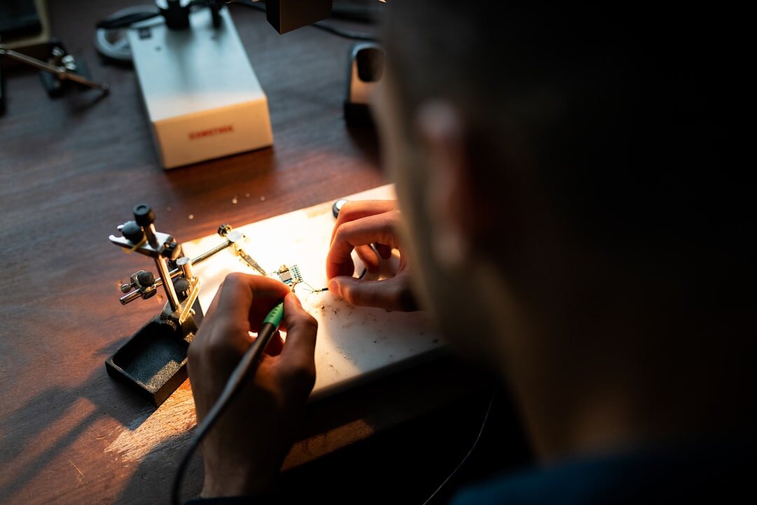 artisan hands working on luxury watch