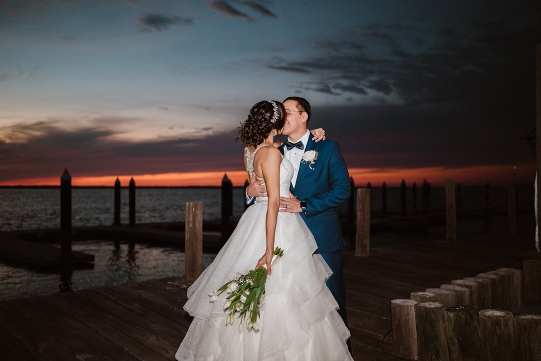 Elegant beachfront terrace set for an evening gala with warm lighting