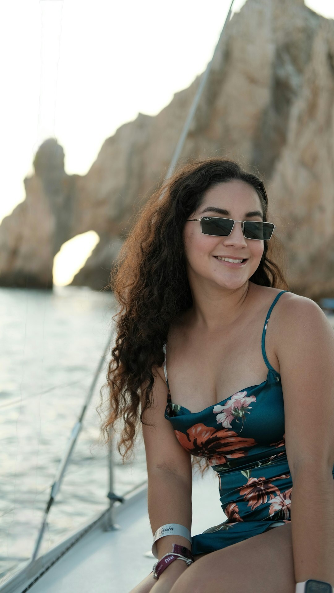 Person wearing polarized sunglasses on a boat with the ocean in the background