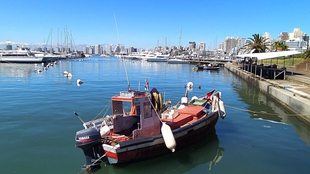 Luxury yacht anchored near the coast of Punta del Este at sunset